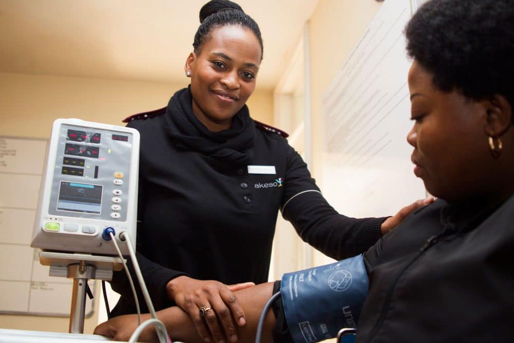 a nurse taking blood pressure